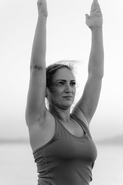 Woman practicing a peaceful yoga pose outdoors with natural light